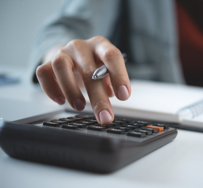 close-up of calculator and hand